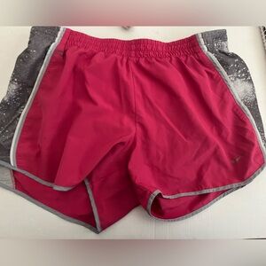Nike lined pink shorts. Size medium. Has a stain on front.